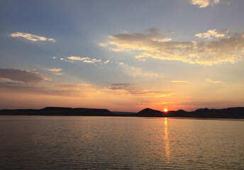 Peaceful evening Sunset reflecting across calm lake