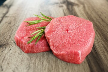Fresh raw meat steaks on desk