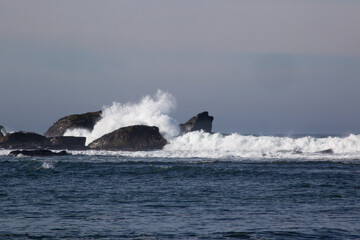 Rocks greeting the waves