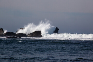 Rocks greeting the waves