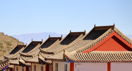 Fototapeta na wymiar The layers of the roofs of small stores near the entrance to Mati Temple Grottoes, Zhangye, Gansu province, China.