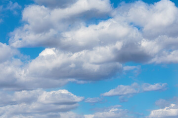 Obraz premium Panorama of cloudy sky. Some clouds are dark and ready to release the rain