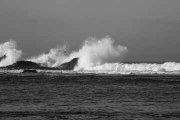 Surf breaking on a rocky shore