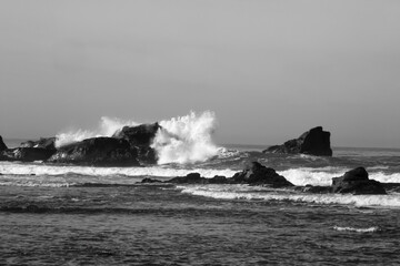 Surf breaking on a rocky shore