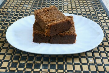 Plain Chocolate Cake double slice being served in a plate
