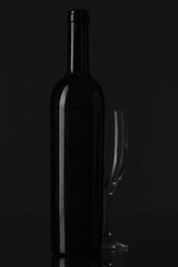 Champagne bottle and glass siluette on black background