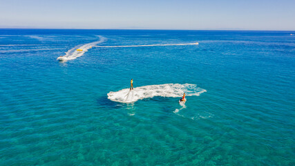 Fly boarding and sea riding in a sunny summer day, Zakynthos, Greece