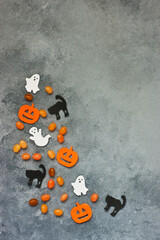 Halloween decorations  and candies on   color  background