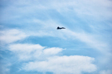 Fighter aircrafts taking off in the blue sky.