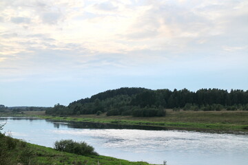 View of the river in the countryside at sunset