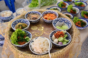 food to a Buddhist monk in traditional thai funeral