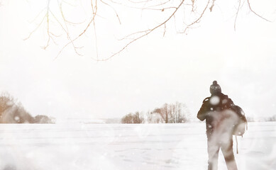 A man on a walk. Winter landscape. Tourist in winter journey.