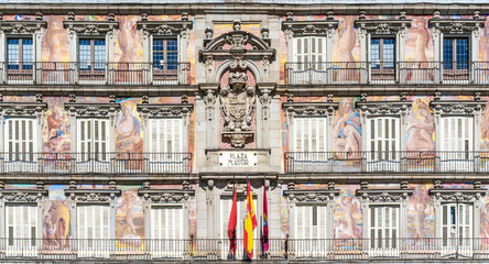 Madrid, Spain - 19 February 2020: Detail of a decorated facade and balconies at the Plaza Mayor, Madrid, Spain.