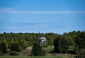 vintage wooden complex with temple watchtower and fortress wall against blue sky