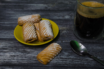 Cake still life with cup of coffee highlighted of sunlight