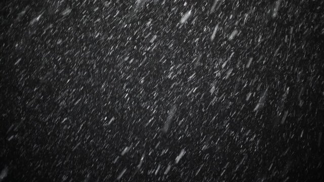 A dense heavy blizzard snowstorm VFX insert in slow-motion on a black screen. Black screen Christmas snowstorm. Particles swirling moved by wind. Snow is moving through space. Snowstorm on black.