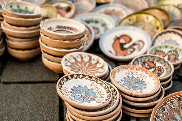 Happy colorful ceramics. Traditional Romanian handmade ceramics market at the potters fair from Sibiu, Romania