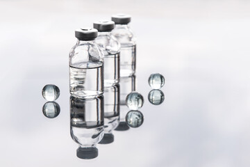 Set of transparent medical bottles and bottles with liquid with different transparent balls.
