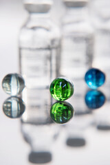 Set of transparent medical bottles and bottles with liquid with different transparent balls.