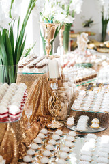 View from distance of table sweet wedding catering full of delicious desserts. Birthday party with candy bar. Food on sweet buffet. Luxury eatery, all inclusive. Concept of unhealthy food, keto diet.