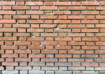 Obraz premium brick red wall. background of a old brick house.