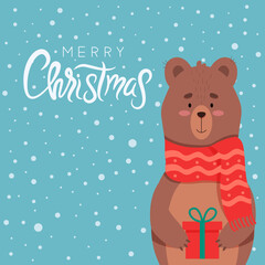 Christmas design. A cute bear in a scarf with a gift stands under the snow. Vector illustration. Lettering with congratulations.