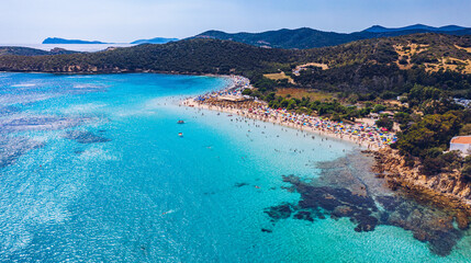 Obraz premium Aerial shot of Tuerredda beach on a beautiful day, Sardinia, Italy. Aerial drone view of Tuerredda in Sardegna. Famous Tuerredda beach on the south of Sardinia near Teulada. Sardinia, Italy.