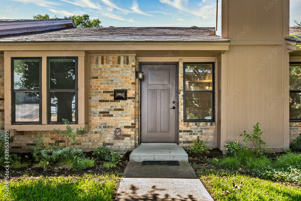 Wall mural entrance of a one story house in dallas texas, usa