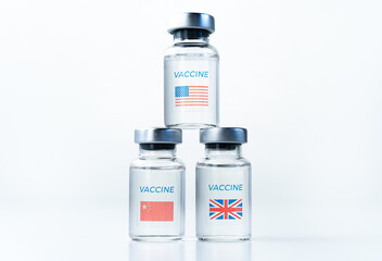 Transparent vials with USA, UK, China flag. New vaccine for covid-19 coronavirus, flu,infectious diseases. Injection after clinical trials for mass vaccination of human,people. Medicine, drug concept
