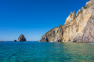 Obraz premium Crystalline green water along the rocky coast of Palmarola island (Ponza, Latina, Italy).