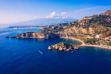 Aerial view of Isola Bella in Taormina, Sicily, Italy. Isola Bella is small island near Taormina, Sicily, Italy. Narrow path connects island to mainland Taormina beach in azure waters of Ionian Sea.