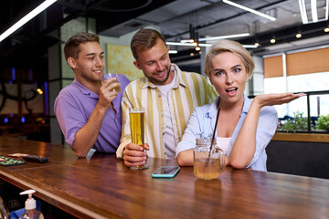 two guys are trying to get to know a girl, but she doesn't like it, she is outraged by their behavior