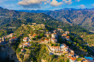 Fototapeta na wymiar Aerial view of Savoca village in Sicily, Italy. Sicilian village Savoca (known from the Godfather movies). Houses on a hill in Savoca, small town on Sicily in Italy.