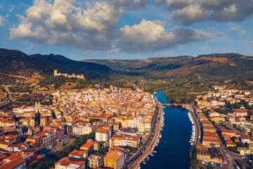 Aerial view of the beautiful village of Bosa with colored houses and a medieval castle. Bosa is...