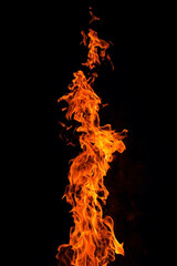Bright orange red Fire flame against black background, abstract texture