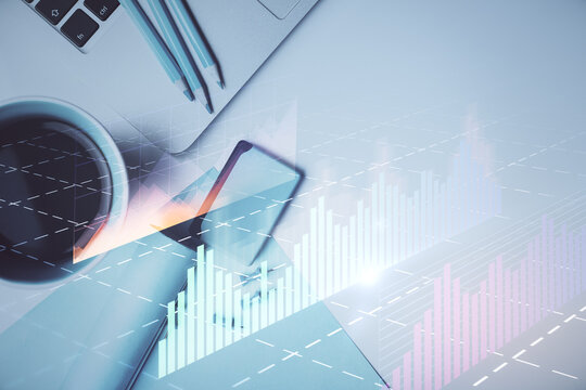 Double exposure of forex graph drawing over desktop background with computer. Concept of financial analysis. Top view.