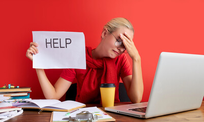 young blonde sad and depressed caucasian manager working in stress at office computer desk feeling...