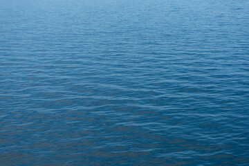 Ripples on the surface of the water or small waves in the sea.