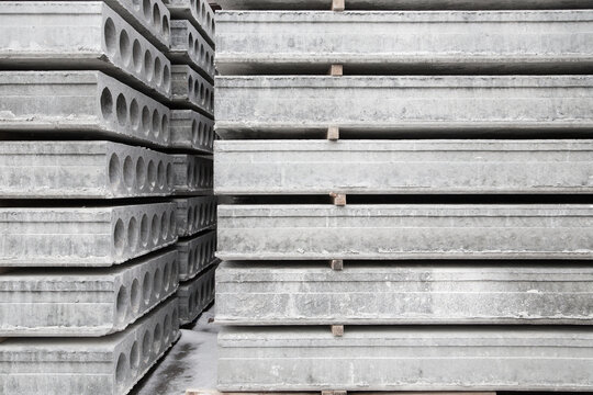 Stack of Prefabricated concrete slabs with hole for construction.