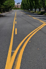 asphalt road with yellow lines