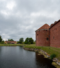 Obraz premium The round red brick tower of Landskrona castle
