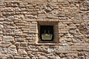 Italian Window with Wooden Shutters in a brick wall