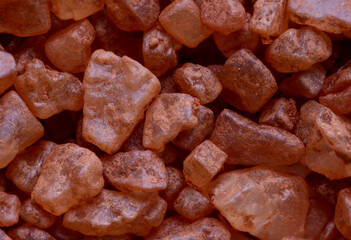 super macro shot food background of .red gold Hawaiian sea salt from the island of Palm  tinted red for decoration