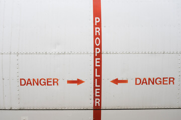 hazard sign on an old airplane hull