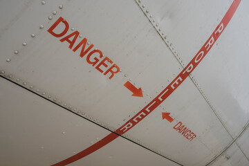 hazard sign on an old airplane hull