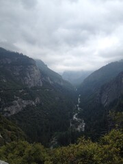 Fototapeta premium Mountain/Valley Landscape with Clouds