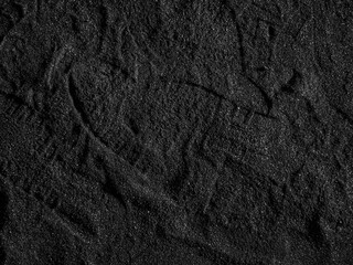 A close up of a black coal texture, dark coal background