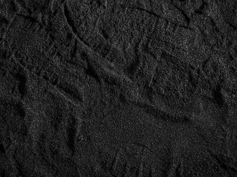 A close up of a black coal texture, dark coal background