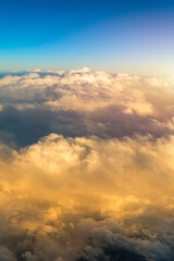 Fototapeta premium Sunny sky abstract background, beautiful cloudscape, on the heaven, view over white fluffy clouds, freedom concept. Aerial view of sky and white clouds. View from airplane.