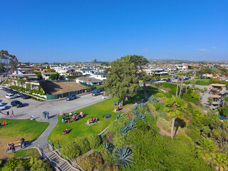 a gorgeous aerial view of the city and people at the park at Corona Del Mar State Beach in Newport...